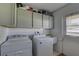 Laundry room with Whirlpool washer and dryer at 3960 Lema Dr, Spring Hill, FL 34609
