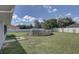 Backyard with above ground pool and stone path at 3960 Lema Dr, Spring Hill, FL 34609
