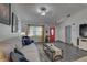 Open living area with dark gray floors and comfortable seating at 3960 Lema Dr, Spring Hill, FL 34609
