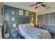 Bedroom with green accent wall and ceiling fan at 3960 Lema Dr, Spring Hill, FL 34609