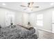 Main bedroom with hardwood floors, ceiling fan, and ensuite bath at 6921 38Th N Ave, St Petersburg, FL 33710