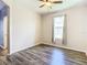 Spacious bedroom with wood-look floors, neutral walls, and a window at 19492 Fort King Run, Brooksville, FL 34601