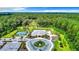 Community clubhouse with pool, tennis, and pickleball courts at 19492 Fort King Run, Brooksville, FL 34601