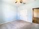 Bedroom with ceiling fan and double doors at 19492 Fort King Run, Brooksville, FL 34601