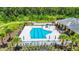Community lap pool with plenty of lounge chairs at 19492 Fort King Run, Brooksville, FL 34601