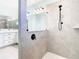 Walk-in shower with tiled walls at 19492 Fort King Run, Brooksville, FL 34601