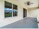 Spacious screened patio with ceiling fan and view of backyard at 19492 Fort King Run, Brooksville, FL 34601