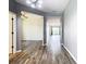 Bright foyer with wood-look flooring and a view to living areas at 19492 Fort King Run, Brooksville, FL 34601