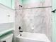 Clean bathroom with a bathtub, shower, and white cabinetry at 19492 Fort King Run, Brooksville, FL 34601