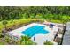 Community lap pool with surrounding patio and landscaping at 19492 Fort King Run, Brooksville, FL 34601