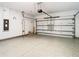 Garage with epoxy flooring and storage options at 19492 Fort King Run, Brooksville, FL 34601