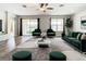 Spacious living room with large windows, plush seating, and a cozy rug at 19492 Fort King Run, Brooksville, FL 34601