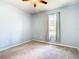 Light blue bedroom with ceiling fan at 19492 Fort King Run, Brooksville, FL 34601