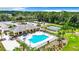Community pool and clubhouse with tennis courts nearby at 19492 Fort King Run, Brooksville, FL 34601