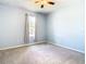 Light blue bedroom with window and ceiling fan at 19492 Fort King Run, Brooksville, FL 34601