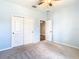 Bedroom with ceiling fan and double doors at 19492 Fort King Run, Brooksville, FL 34601