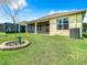 House with a large backyard and screened patio at 19492 Fort King Run, Brooksville, FL 34601