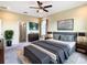 Main bedroom with ceiling fan, large windows, and ensuite bathroom access at 19492 Fort King Run, Brooksville, FL 34601