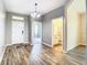 Spacious foyer with wood-look floors and access to other rooms at 19492 Fort King Run, Brooksville, FL 34601