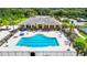 Community pool with adjacent clubhouse and lounge area at 19492 Fort King Run, Brooksville, FL 34601