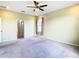 Bright and airy bedroom with carpeted floors and large window at 19492 Fort King Run, Brooksville, FL 34601