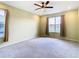 Spacious bedroom with carpeted floor and window with curtains at 19492 Fort King Run, Brooksville, FL 34601