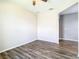 Spacious living room with wood-look flooring and neutral walls at 19492 Fort King Run, Brooksville, FL 34601