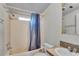 Bathroom with shower/tub combo, toilet, and vanity at 9520 Merton St, New Port Richey, FL 34654