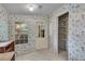 Laundry room with window, shelving, and floral wallpaper at 9520 Merton St, New Port Richey, FL 34654