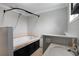 Bathroom with a bathtub, shower, and single vanity at 7446 Donegal St, New Port Richey, FL 34653