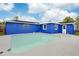 Inviting backyard pool with blue house exterior at 7446 Donegal St, New Port Richey, FL 34653