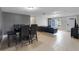 Living room with leather couches and tile floors at 7446 Donegal St, New Port Richey, FL 34653