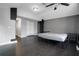 Main bedroom with dark flooring, ceiling fan, and ample closet space at 7446 Donegal St, New Port Richey, FL 34653
