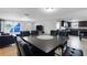 Open dining area with dark wood table and leather chairs at 7446 Donegal St, New Port Richey, FL 34653