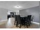 Open concept dining room with seating for six and kitchen views at 7446 Donegal St, New Port Richey, FL 34653