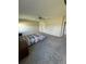 Spacious primary bedroom with carpeted floors and neutral walls at 15434 Miller Creek Dr, Sun City Center, FL 33573