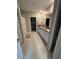 Main bathroom with double vanity, shower, and linen closet at 15434 Miller Creek Dr, Sun City Center, FL 33573