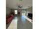 Spacious living room with tile floors and access to the backyard at 15434 Miller Creek Dr, Sun City Center, FL 33573
