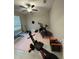 Home gym with various exercise equipment including a rowing machine and treadmill at 15434 Miller Creek Dr, Sun City Center, FL 33573