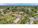 Single-story home with a landscaped yard and paved driveway at 800 61St N St, St Petersburg, FL 33710