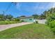 House exterior with a paved driveway and white fence at 800 61St N St, St Petersburg, FL 33710