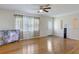 Living room with hardwood floors, ceiling fan and TV at 800 61St N St, St Petersburg, FL 33710