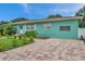 Side view of the house with brick paver driveway at 800 61St N St, St Petersburg, FL 33710
