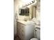 Bathroom with double vanity and large mirror at 20861 Haulover Cv # C4, Lutz, FL 33558