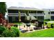 Building exterior with shared patio and grill at 20861 Haulover Cv # C4, Lutz, FL 33558