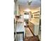 Galley kitchen with adjacent hallway to bedroom at 20861 Haulover Cv # C4, Lutz, FL 33558