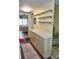 Long hallway with extra cabinets and mirrored wall at 20861 Haulover Cv # C4, Lutz, FL 33558