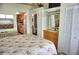 Bedroom with mirrored closet and view into kitchen and bathroom at 20861 Haulover Cv # C4, Lutz, FL 33558