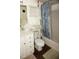 Bathroom with shower/tub combo and vanity with drawers at 20861 Haulover Cv # C4, Lutz, FL 33558