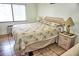 Spacious bedroom with large window and nightstand at 20861 Haulover Cv # C4, Lutz, FL 33558